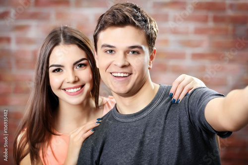 Teenager couple making phot...