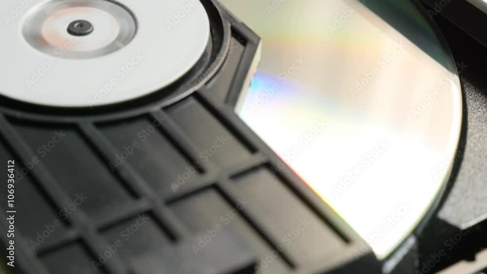 Finishing reading sequence of CD disk in player mechanism 4K 2160p UltraHD footage - DVD disc in players mechanism rotating fast 4K 3840X2160 UHD video Finishing reading sequence of CD disk in player mechanism 4K 2160p UltraHD footage - DVD disc in players mechanism rotating fast 4K 3840X2160 UHD video
