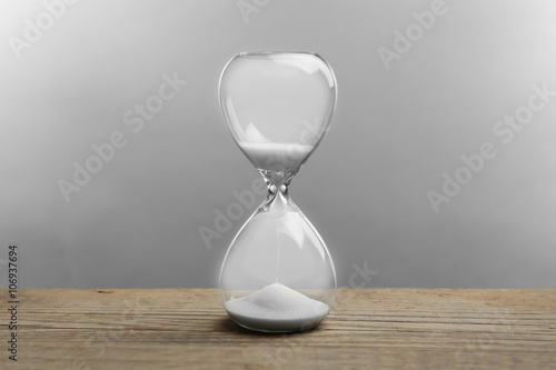 Hourglass on grey background