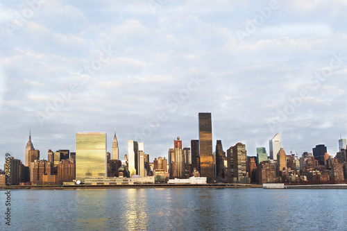 View of East River and manhattan skyline, New York, USA photo