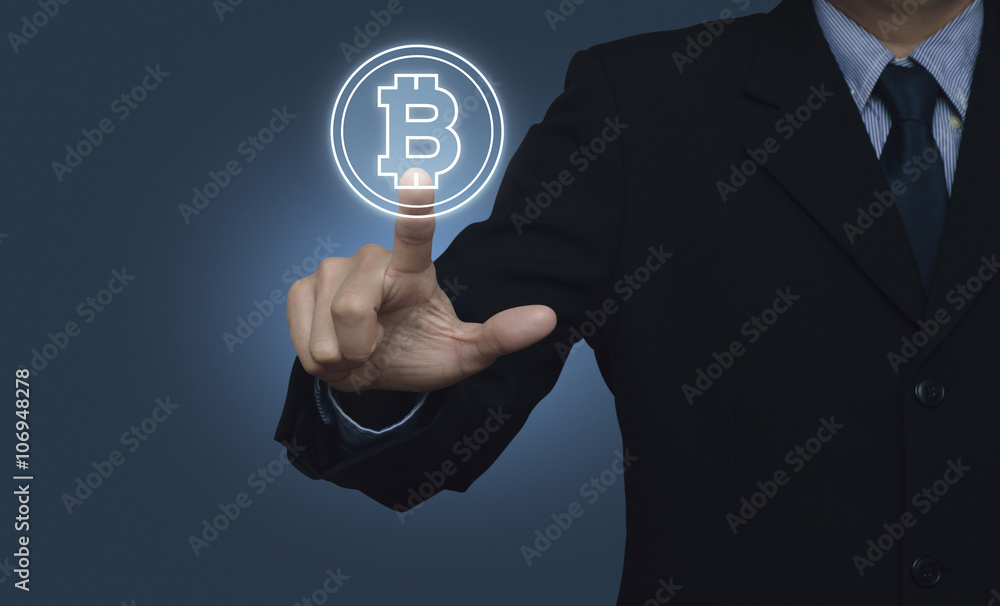Businessman pressing bitcoin icon on blue background, Choosing b Businessman pressing bitcoin icon on blue background, Choosing b