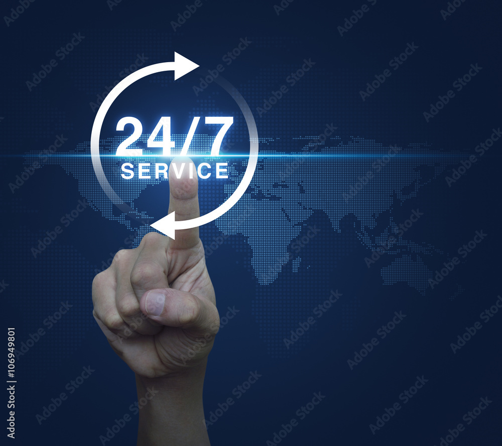 Hand pressing button 24 hours service icon over digital world ma