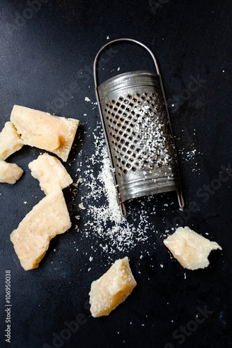 Parmesan cheese with a grater