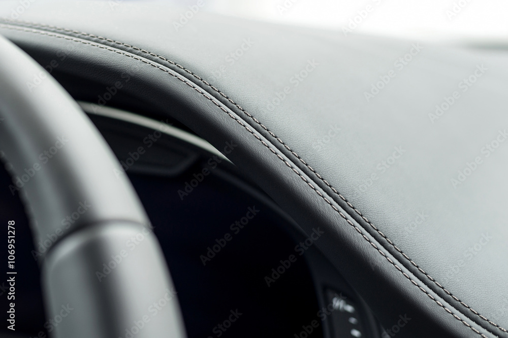 Leather car dashboard detail.