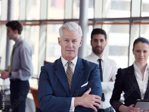 Wallpaper Mural portrait of senior businessman as leader  with staff in backgrou Torontodigital.ca
