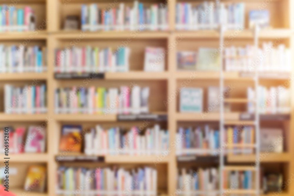 blurred bookshelf in library room for your background design Stock