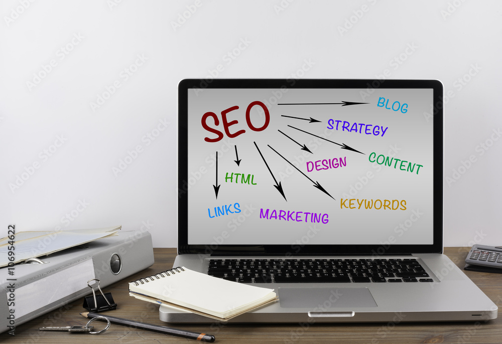 Office desk with a laptop. SEO concept Office desk with a laptop. SEO concept