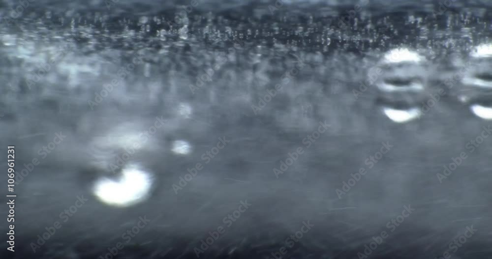 Oil drops floating in water over a colorful underground with oil painting effect. Oil drops floating in water over a colorful underground with oil painting effect.