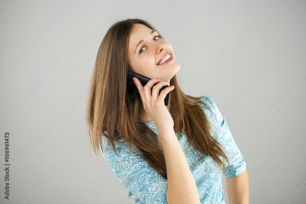 Beautiful young woman talking on mobile phone Beautiful young woman talking on mobile phone