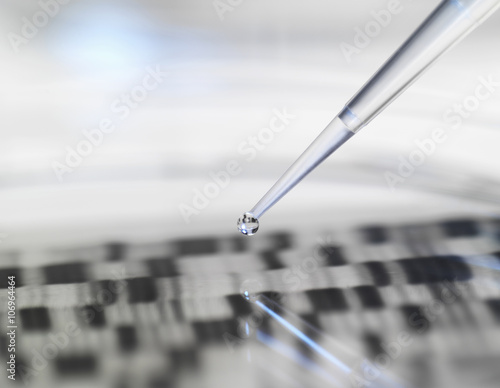 Pipette and petri dish with autoradiogram photo