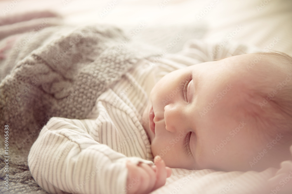 Two month old baby boy asleep in crib Two month old baby boy asleep in crib