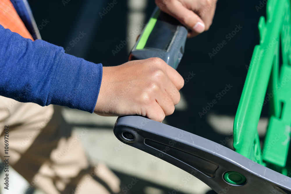 Closeup of man hand with shopping cart