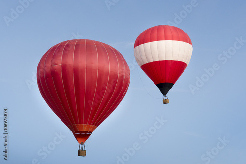 Hot air balloon ride in blue skies