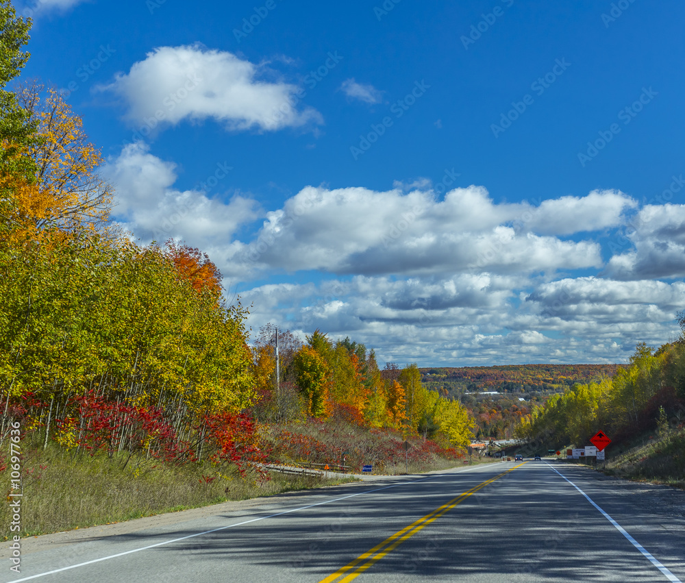 the view down a scenic country roadway in autumn landscape the view down a scenic country roadway in autumn landscape