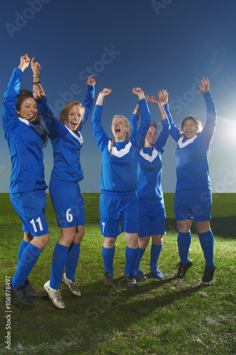 Female football team cheering photo