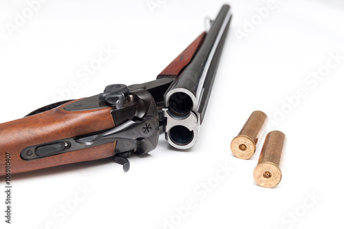 Photos Shotgun with bullets on white background