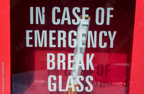 a cigarette in a box with safety glass photo