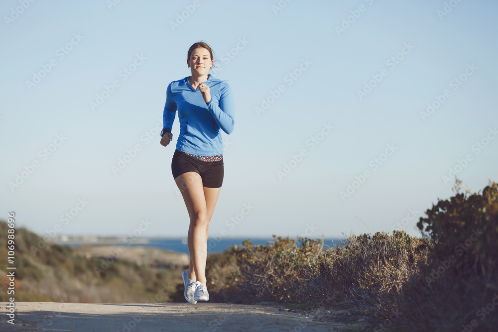 Sport runner jogging on beach working out