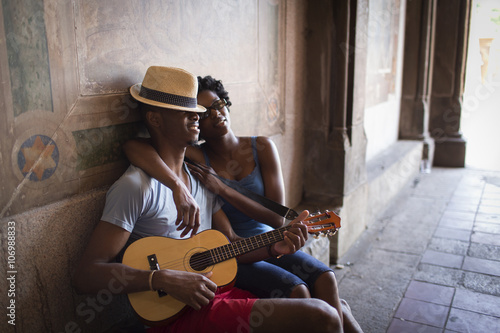 Young couple sitting with mandolin 