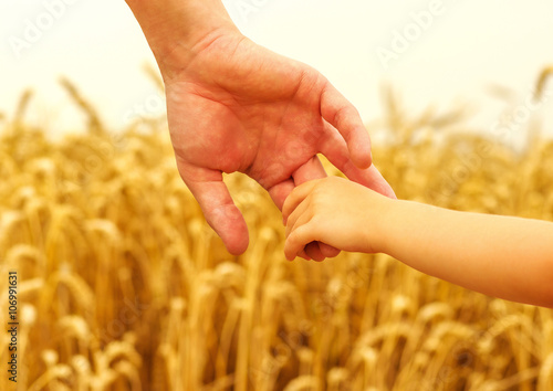 hands of child and father