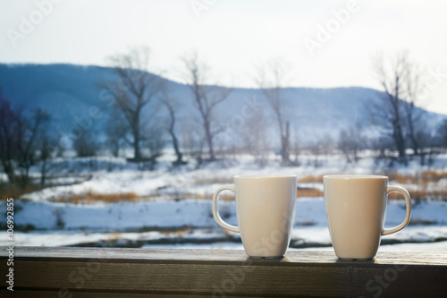 two hot chocolate cups outdoors