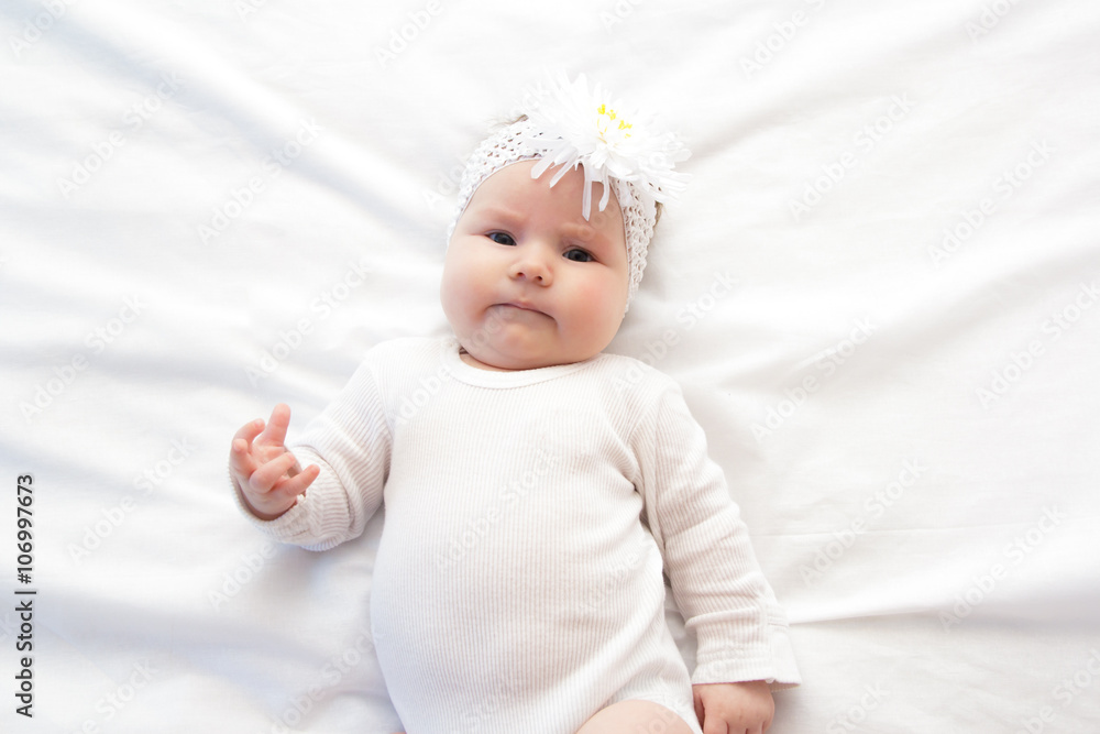 Little newborn girl lying on the bed Little newborn girl lying on the bed