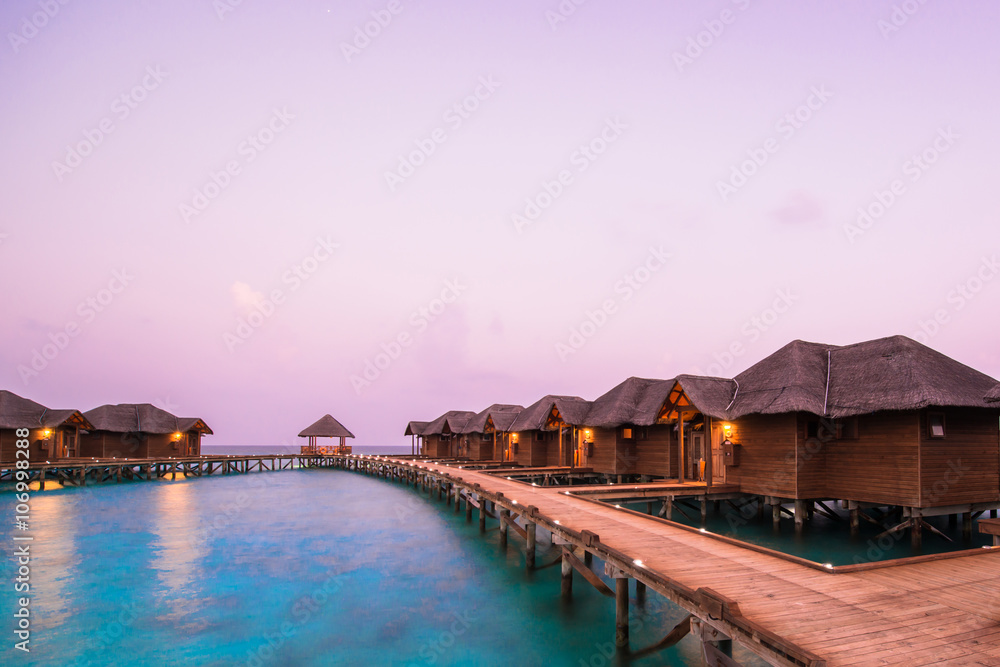 Over water bungalows with steps into amazing green lagoon 