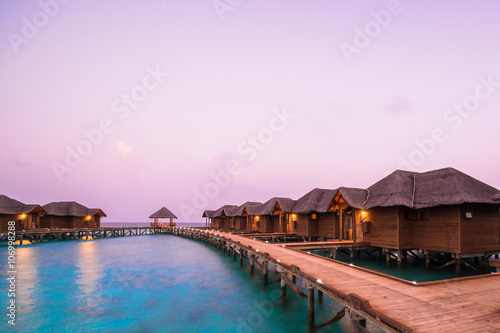 Over water bungalows with steps into amazing green lagoon  © theyok