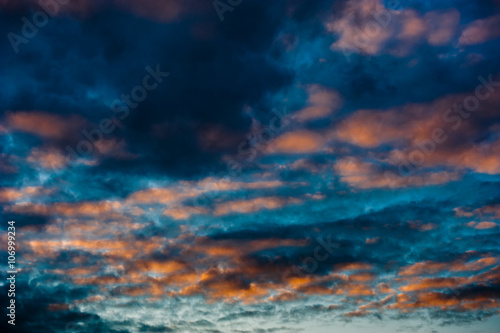 Black clouds in the sky and sunset colors