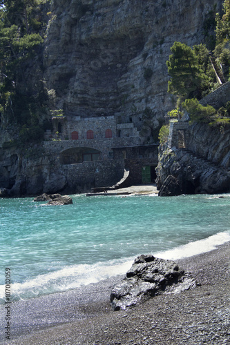 Stones, boulders and cliffs of Fornillo Beach in Positano, Italy, along the Amalfi Coast. photo