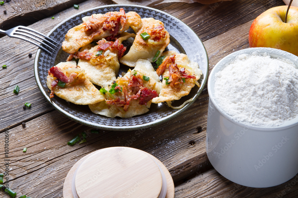Polish fried dumplings with meat, onion and bacon.