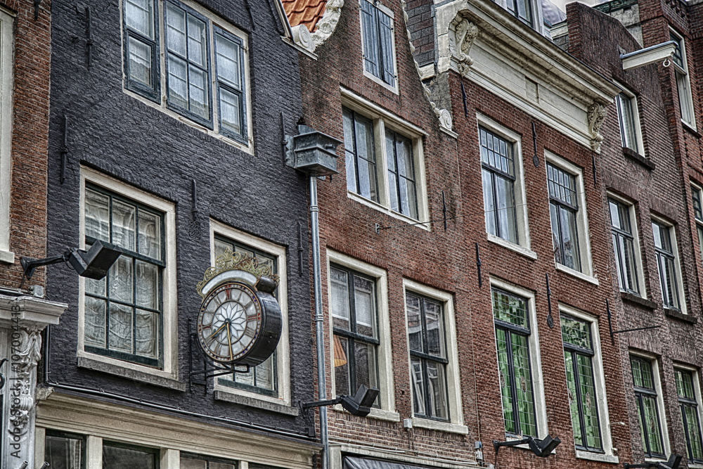 Fototapeta premium Details of Clock in street Nieuwe Spiegelstraat in Amsterdam, th