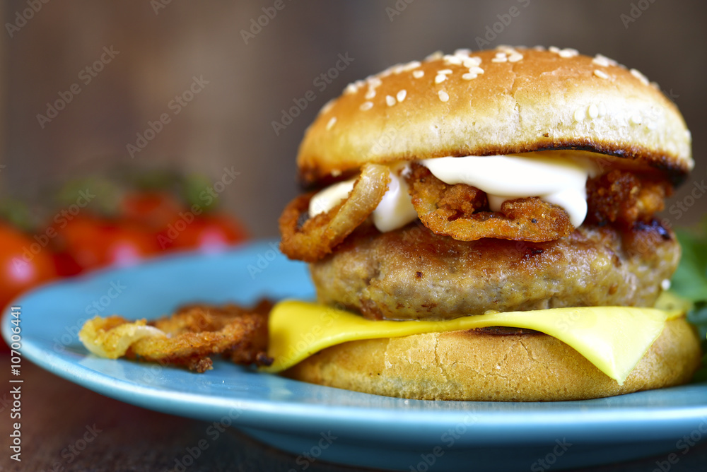 Burger with meat cutlet and caramelized onion.