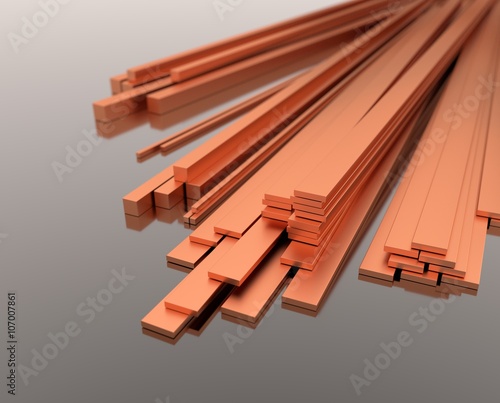 Miedziane płaskowniki na szarym tle