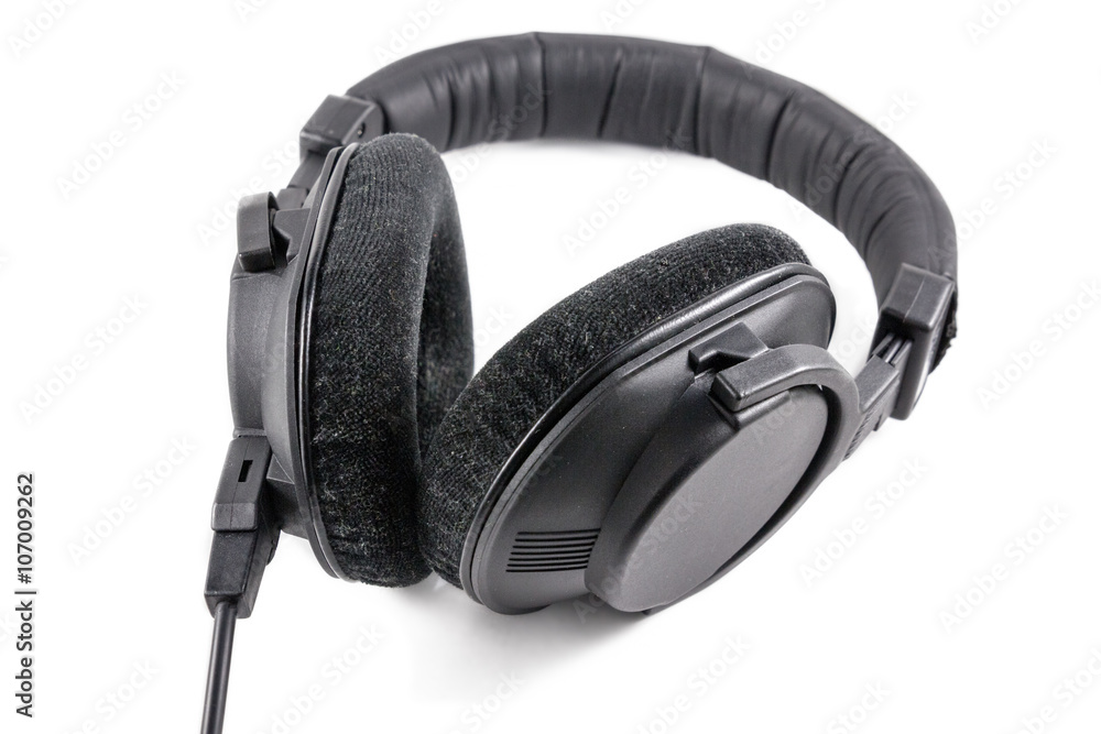 Black professional headphones isolated on white background