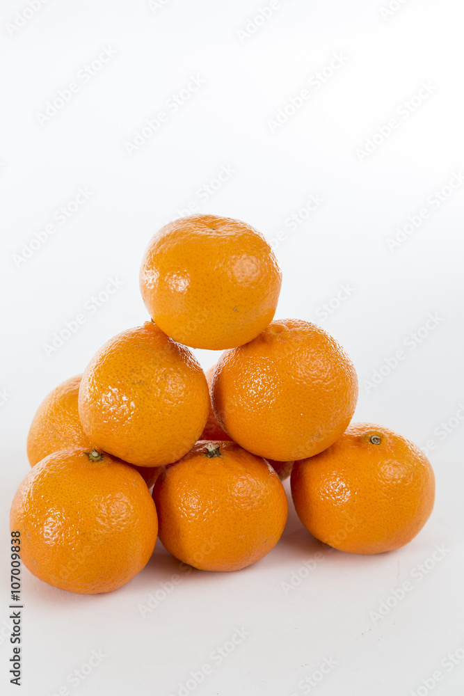 Bright Orange Clementines on a bright background Bright Orange Clementines on a bright background