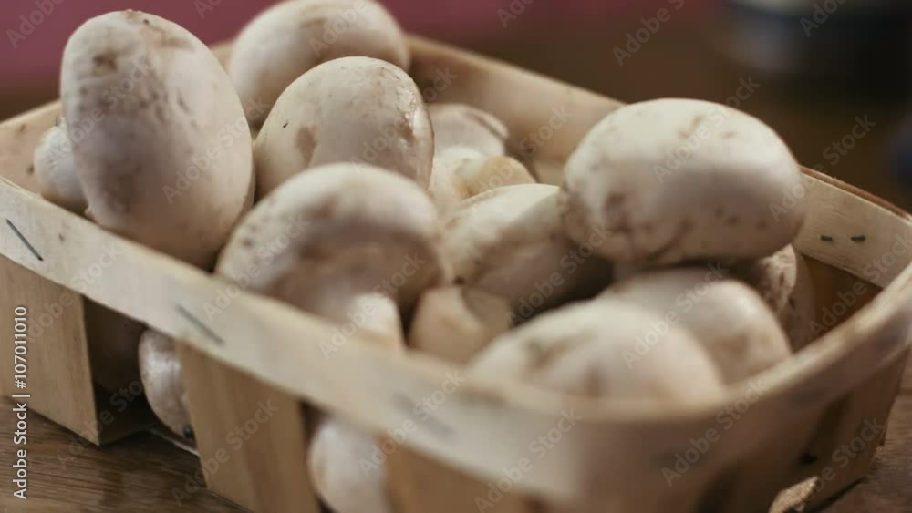 Heap of fresh and very tasty champignon mushrooms on a wooden background. Heap of fresh and very tasty champignon mushrooms on a wooden background.