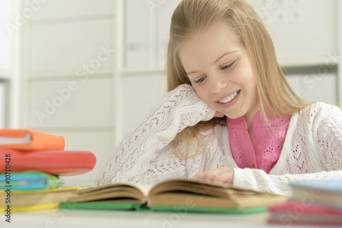 Beautiful little girl with book