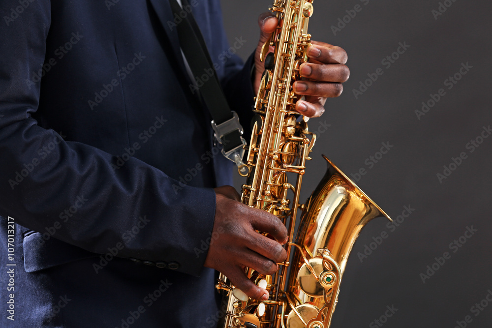 Obraz premium African American jazz musician playing the saxophone, closeup