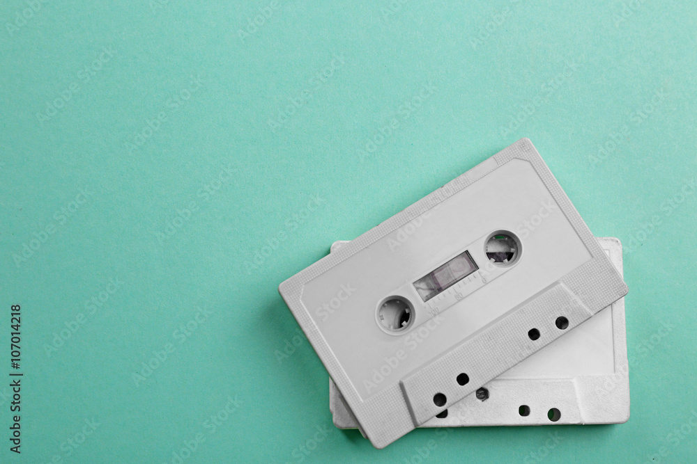 Old audio cassettes on turquoise background Old audio cassettes on turquoise background
