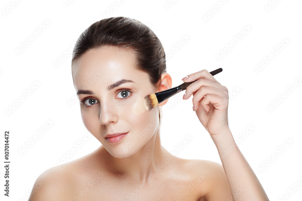 Beauty Girl with Makeup Brushes. Natural Makeup for Brunette Woman with blue Eyes. Beautiful Face. Makeover. Perfect Skin. Applying Make-up. Ideal for commercial Beauty Girl with Makeup Brushes. Natural Makeup for Brunette Woman with blue Eyes. Beautiful Face. Makeover. Perfect Skin. Applying Make-up. Ideal for commercial