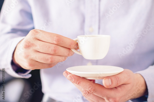 Coffee cup in male hands
