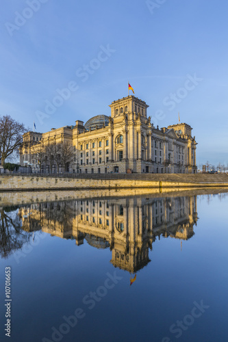 Reichstag with reflection in river Spree photo