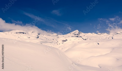 Winter landscape with snow covered mountains.
