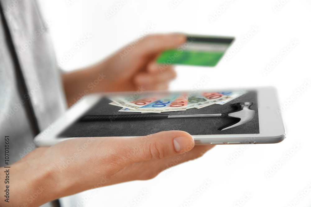 Female hands with digital tablet and credit card, closeup Female hands with digital tablet and credit card, closeup