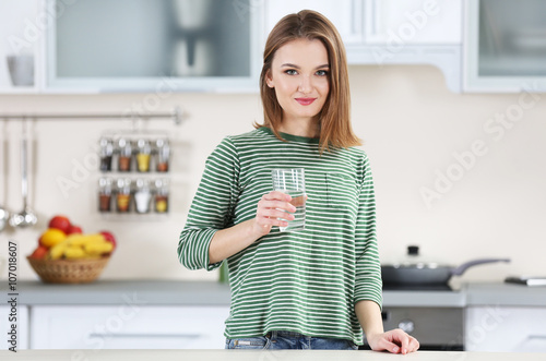 Young woman with glass of w...