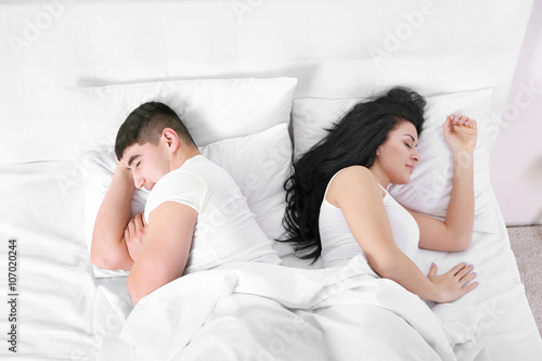Lovely couple sleeping in w...