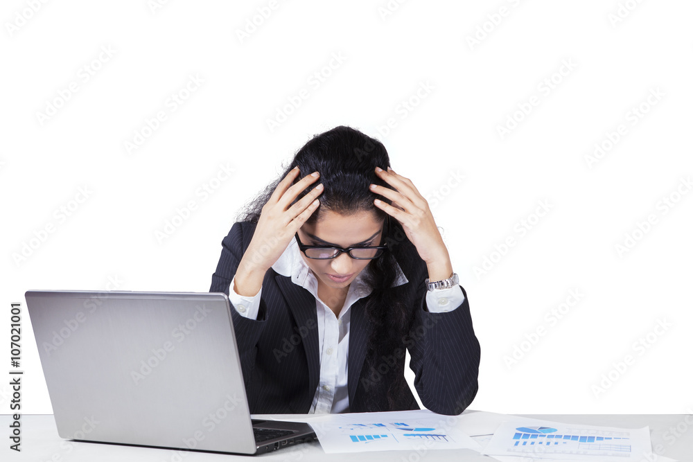 Confused Indian worker with financial chart Confused Indian worker with financial chart
