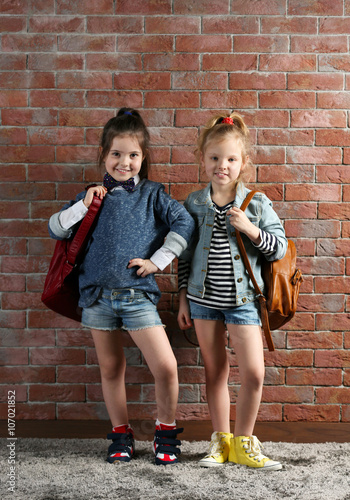 Two stylish little girls wi...