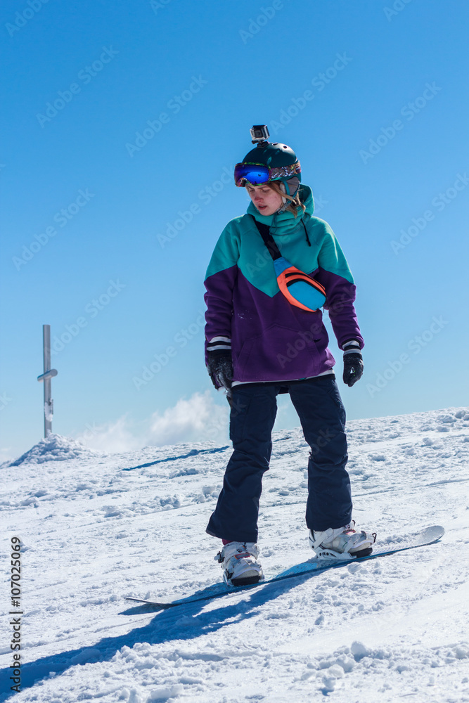 girl goes on a snowboard